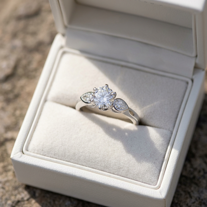 Lauren round brilliant diamond three stone engagement ring with pear shape shoulder stones, side view