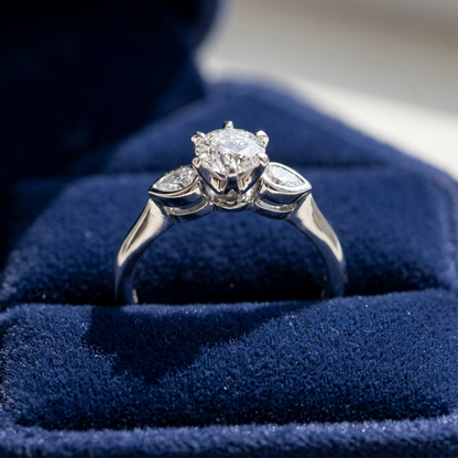 Lauren round brilliant diamond three stone engagement ring with pear shape shoulder stones, top view