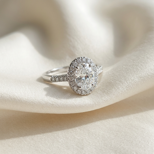 Lucienne oval cut diamond halo engagement ring, angled view