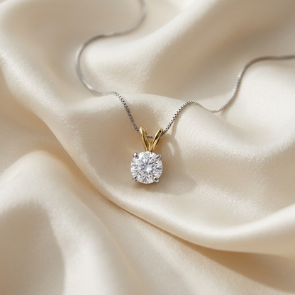 Round diamond solitaire pendant in two tone gold