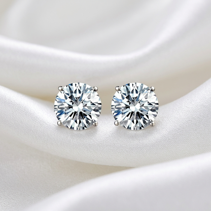 Round diamond stud earrings in a four claw setting