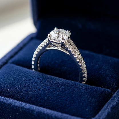 Round diamond ring with side stones - angled view