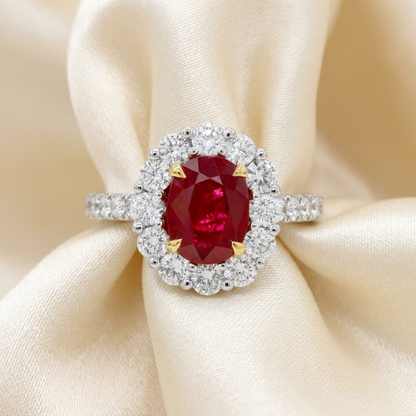 Oval ruby and diamond halo ring with diamond set band - detail view