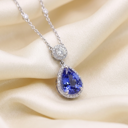 Pear shape tanzanite and diamond halo pendant in 18ct white gold — handcrafted in Sydney