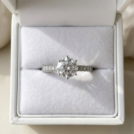 Round diamond ring with side stones - angled view