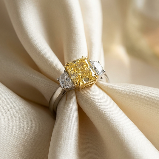 Fancy yellow radiant diamond ring with half moon side stones - side view